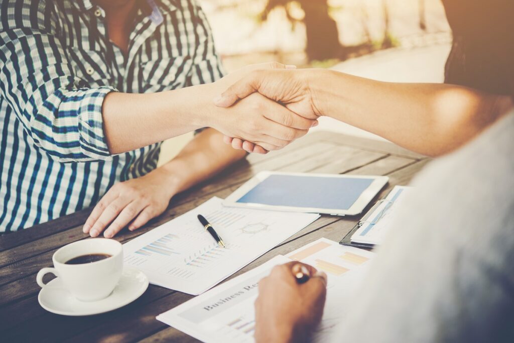 two people shaking hands - Working Together on Foreign Policies With the Help of RSI