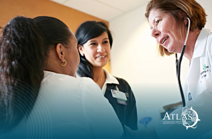 Doctor helping patient with medical translator at her side.